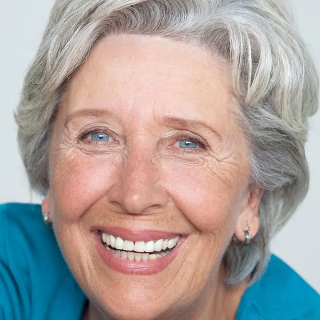 Classic shoulder length gray layered lob haircut on a mature woman
