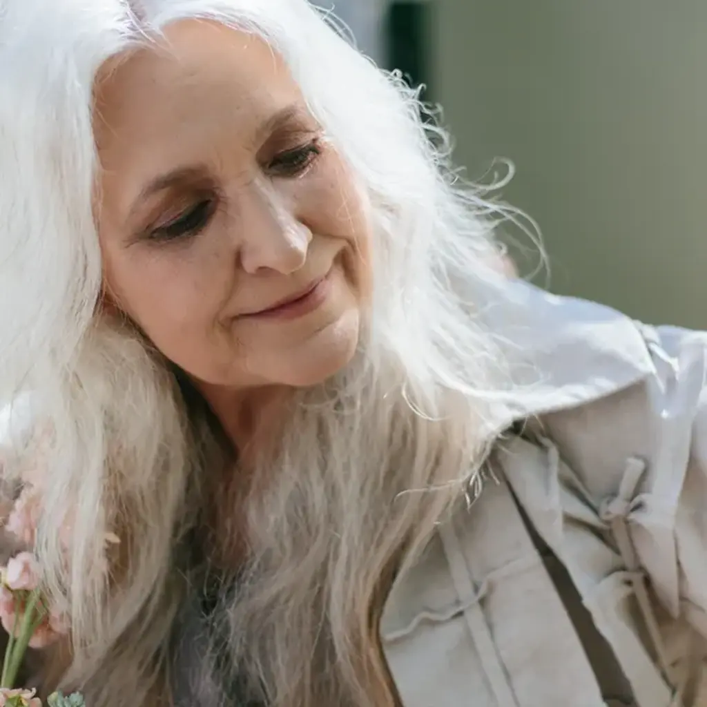 Wavy shoulder length gray hair with soft layered beachy texture